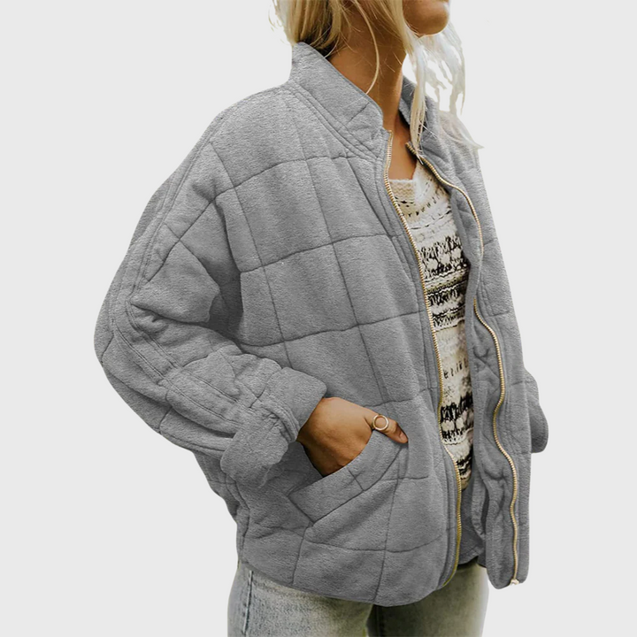 Stylish women's oversized mid-season coat, showcasing a comfortable relaxed fit