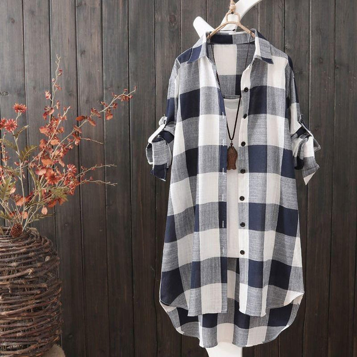 Trendy women's longline plaid shirt, comfortable & versatile, shown buttoned for a relaxed fit, ideal for fall fashion.