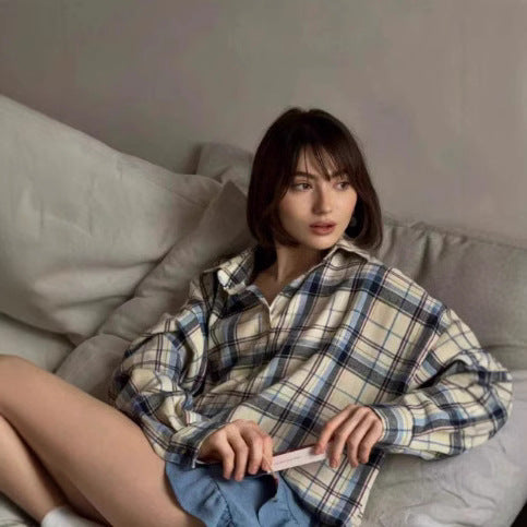 Fashionable women's oversized plaid top. Comfortable long sleeve button-down shirt blouse for casual chic style.