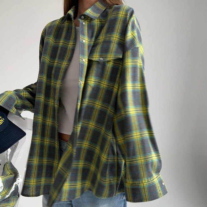 Chic women's long sleeve plaid shirt. Oversized button-down blouse, comfortable and stylish for casual wear.