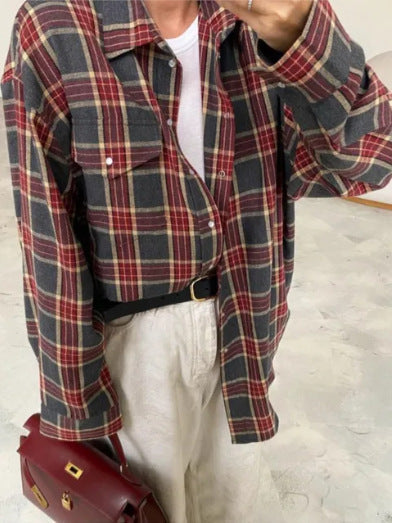 Stylish women's plaid oversized button-down. Long sleeve blouse shirt, chic and comfortable for casual fashion.