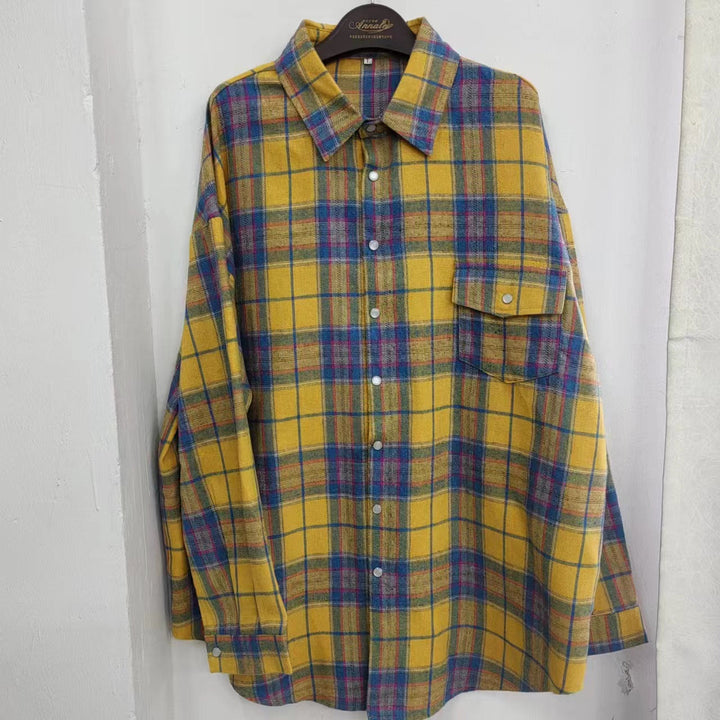 Women's oversized checkered long sleeve shirt. Comfortable button-down blouse, stylish for casual everyday fashion.