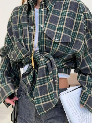 Chic women's checkered oversized shirt. Long sleeve button-down blouse, stylish and comfortable for fashion.