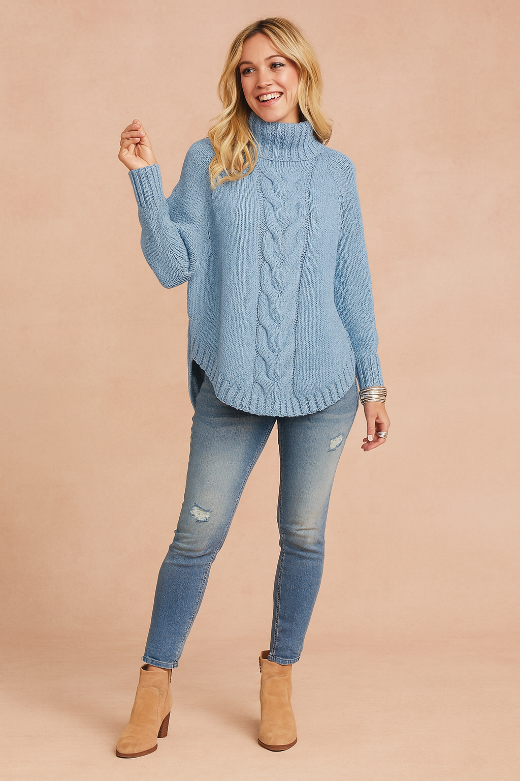 Women's oversized turtleneck sweater in a cozy, relaxed fit, perfect for fall and winter fashion.