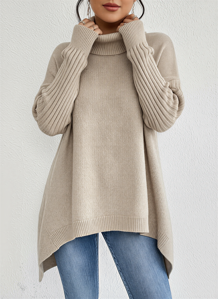 Long sleeve women's oversized sweater with a cozy turtleneck and practical front pocket for everyday wear.