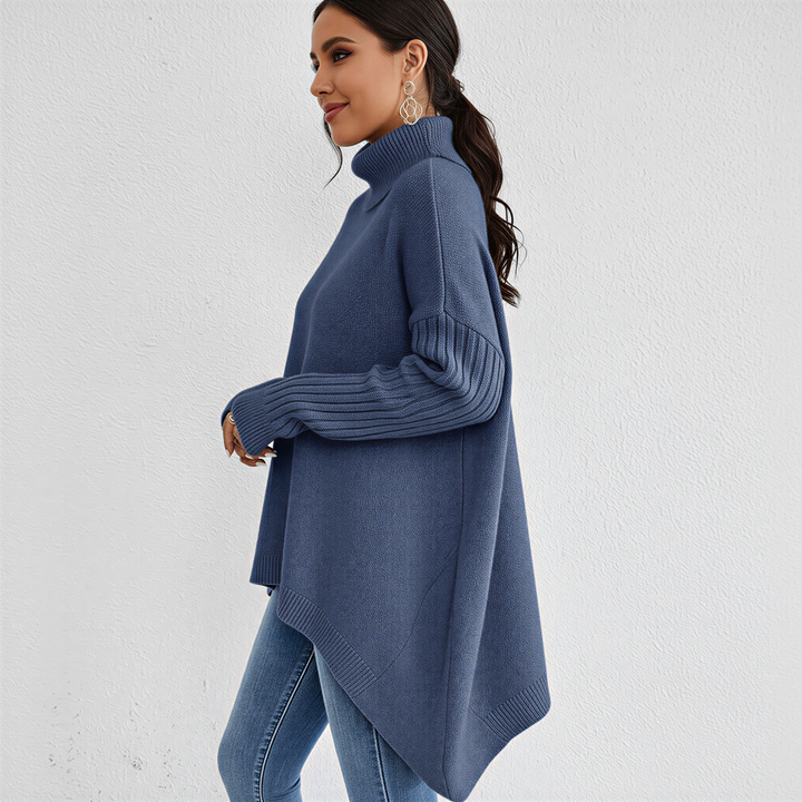 Warm women's oversized turtleneck pullover with a spacious front pocket, suitable for cooler spring days.