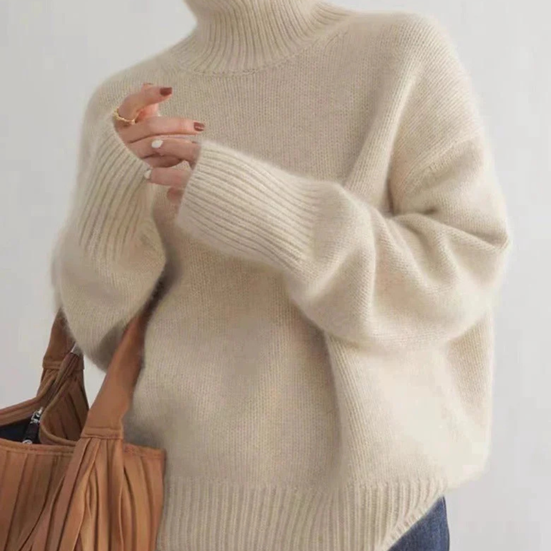 Women's oversized turtleneck sweater in light grey, perfect for casual spring comfort