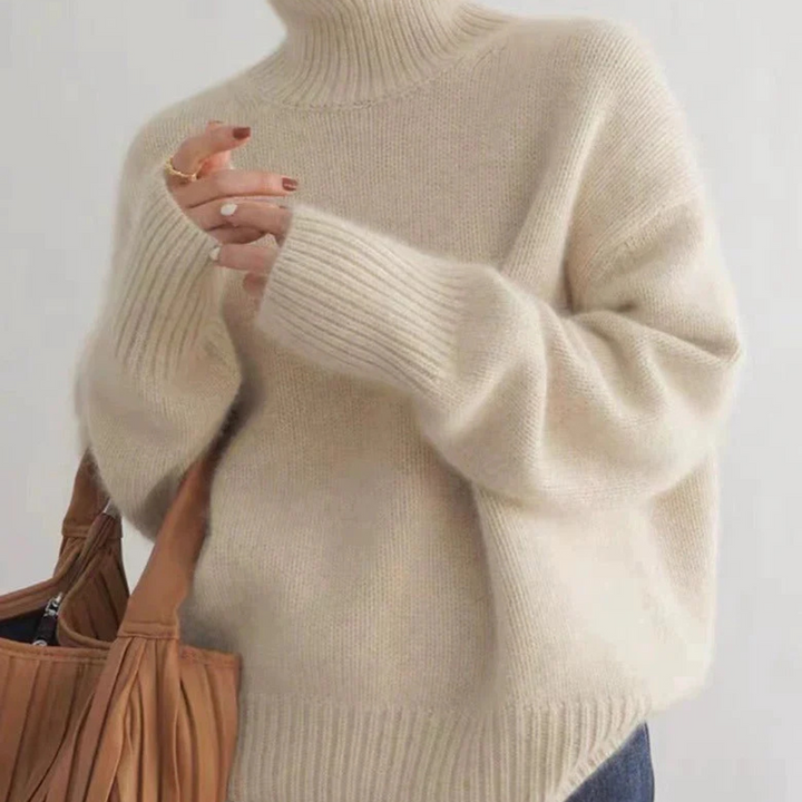 Women's oversized turtleneck sweater in light grey, perfect for casual spring comfort