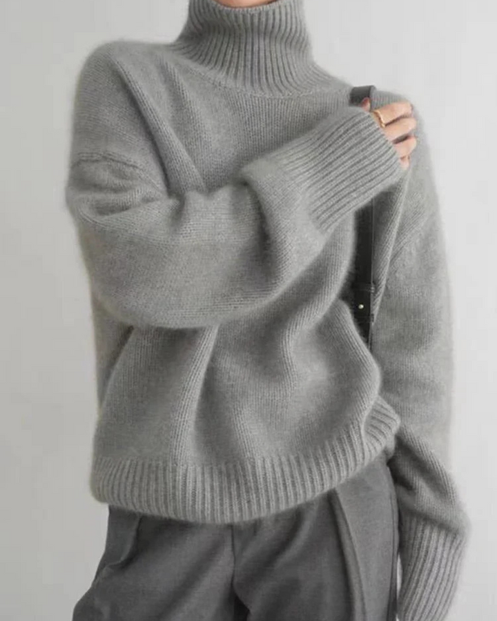 Stylish women's black oversized turtleneck knit sweater for a relaxed everyday look