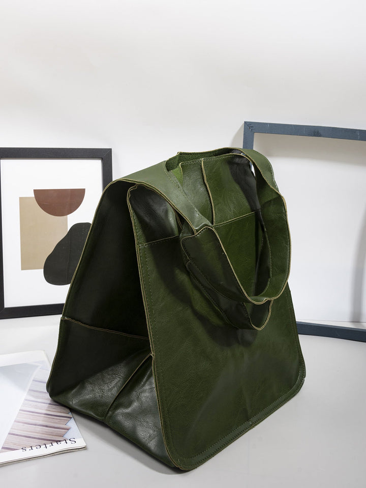 Women's vintage leather shoulder bag in a neutral color, suitable for work or casual outings