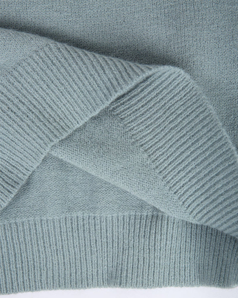 Trendy women's crewneck sweater, adorned with an eye-catching pattern, suitable for spring comfort.