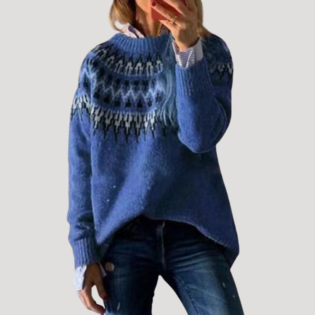 Close-up of a women's patterned knit pullover, showing intricate design and soft texture