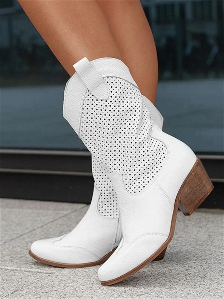 Elegant women's perforated western ankle boots. Neutral color, block heel, pointed toe. Versatile stylish footwear.