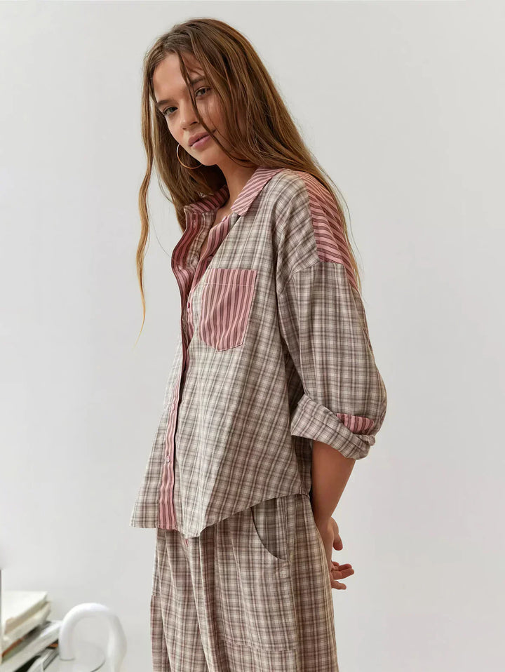 Stylish women's plaid top and shorts set in pink and blue, ideal for comfortable spring attire