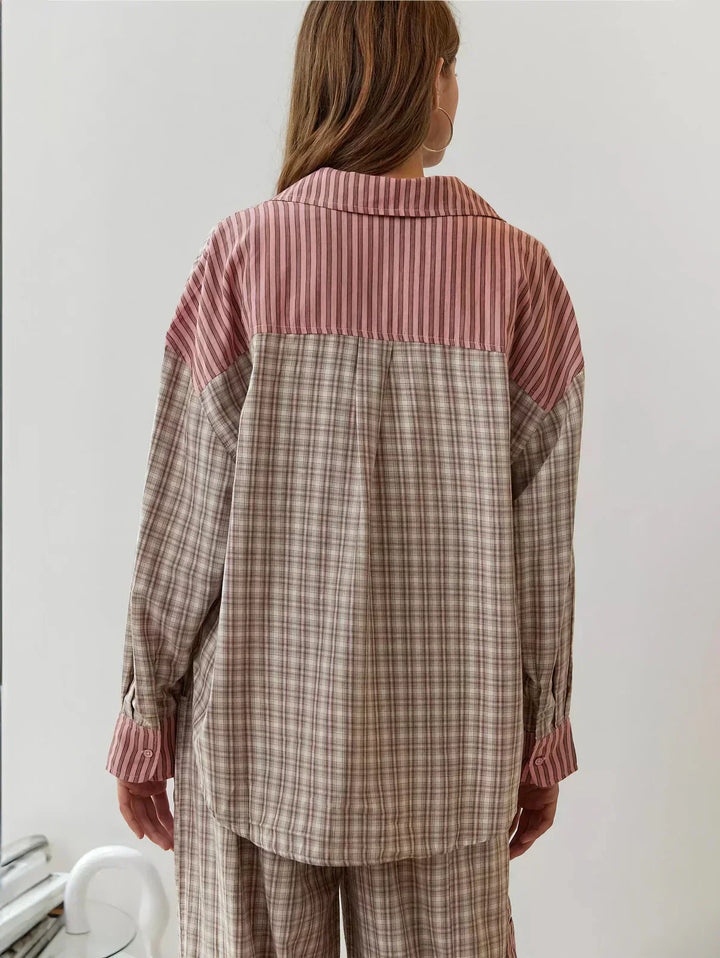 Close-up of a women's pink and blue plaid two-piece set, showcasing the fabric pattern and casual style