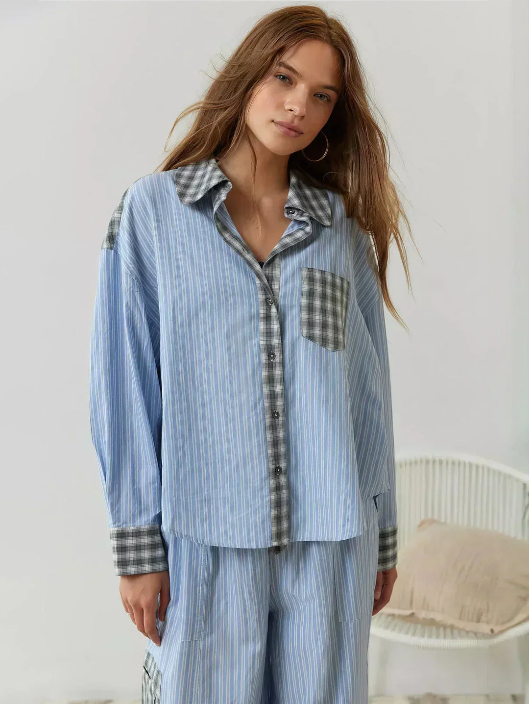 Detailed view of the plaid pattern on a women's two-piece spring set, with shades of pink and blue