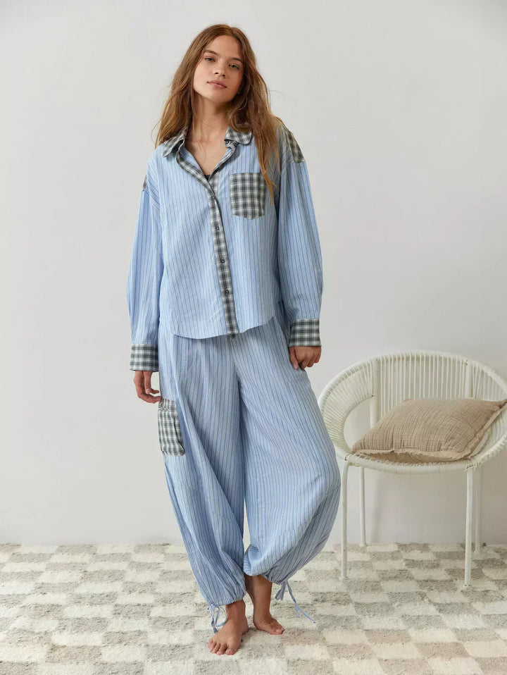 A women's spring attire fashion shot, featuring a trendy pink and blue plaid two-piece top and shorts set