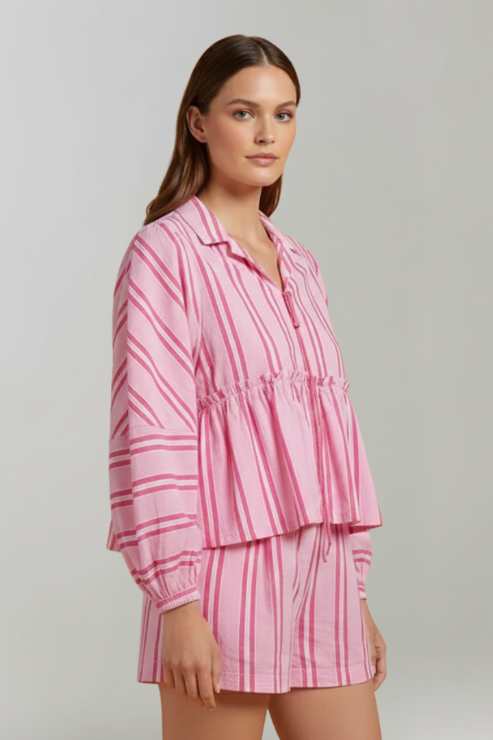 Casual women's striped shorts set with long sleeves in a vibrant pink hue, ideal for summer.