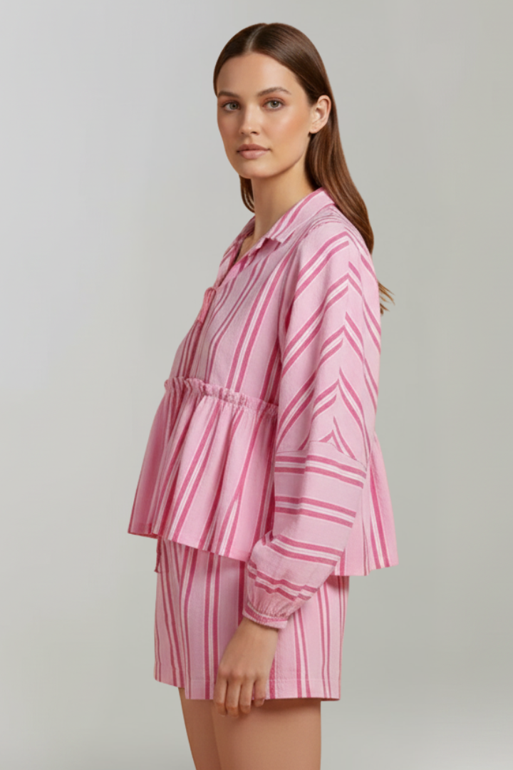 Close-up of a women's striped long sleeve and shorts set in pink, highlighting the soft fabric.