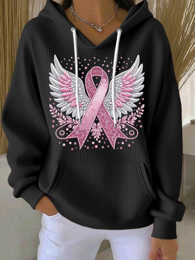 Close-up of a pink awareness ribbon detail on a women's comfortable pullover hoodie.