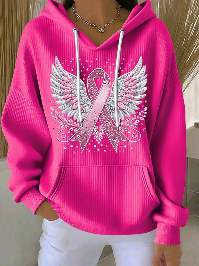 Model wearing a comfortable women's awareness ribbon hoodie pullover, promoting cancer support.