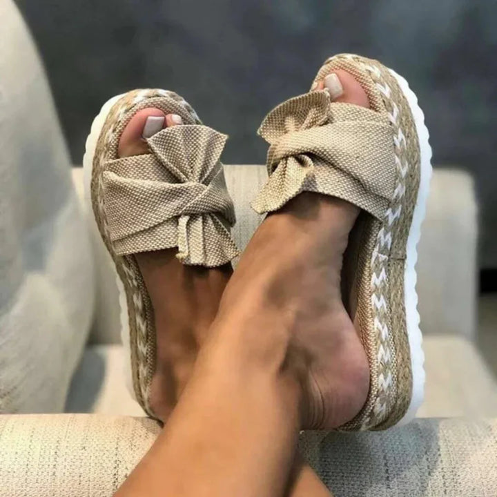Women's pink bow platform slide sandals, perfect for spring casual wear & comfort