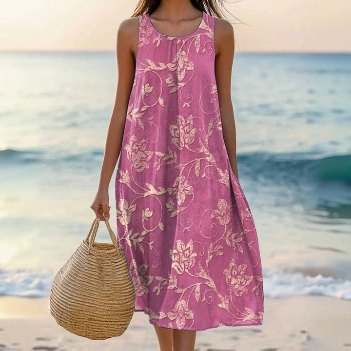 Women's pink floral midi summer dress, sleeveless & loose fit for comfortable casual or beach wear.