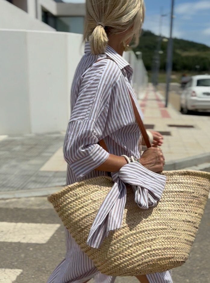 Pink and white striped button down dress for women, a stylish and comfortable summer midi.