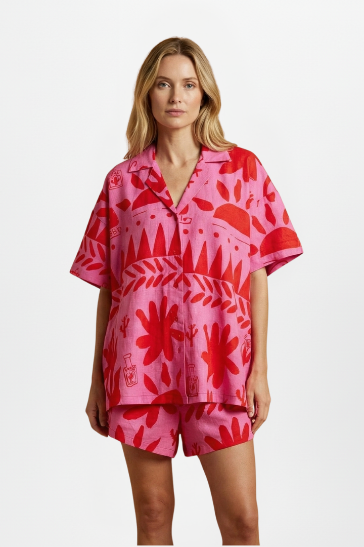 Stylish women's printed shorts and matching top set in pink, ideal for vacation outfits