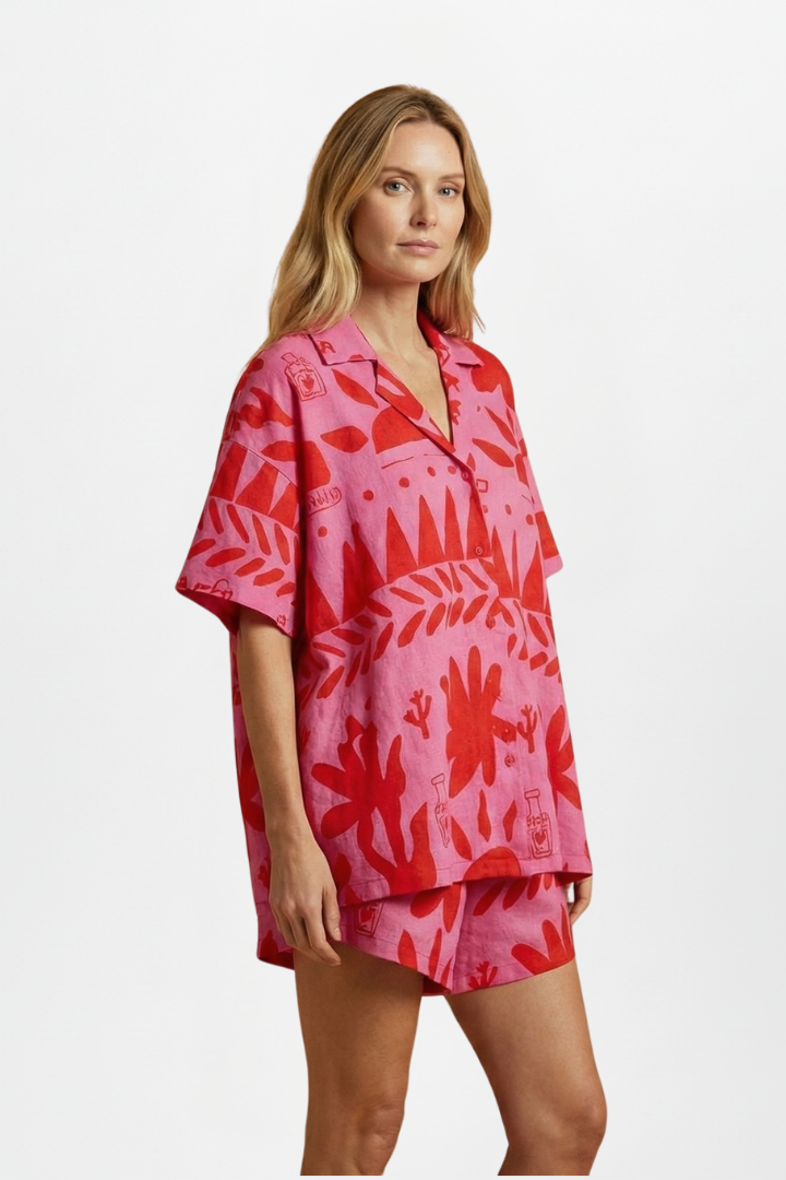 Trendy women's two piece shorts set with a playful print in pink, great for warm weather