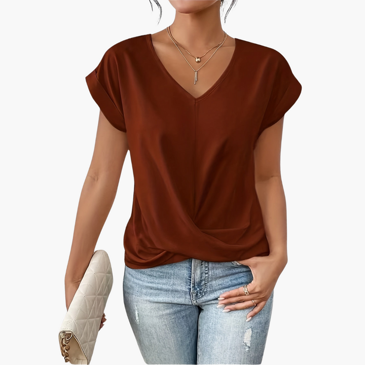 Close-up of a blue V-neck draped top for women, showing soft fabric and relaxed fit, summer style