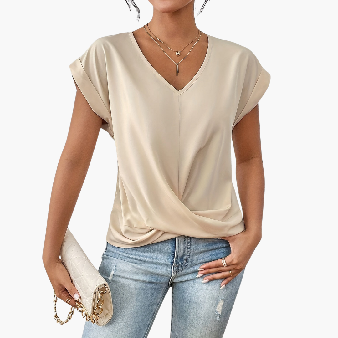 Casual grey V-neck blouse with draping detail, essential women's apparel for warm weather, relaxed