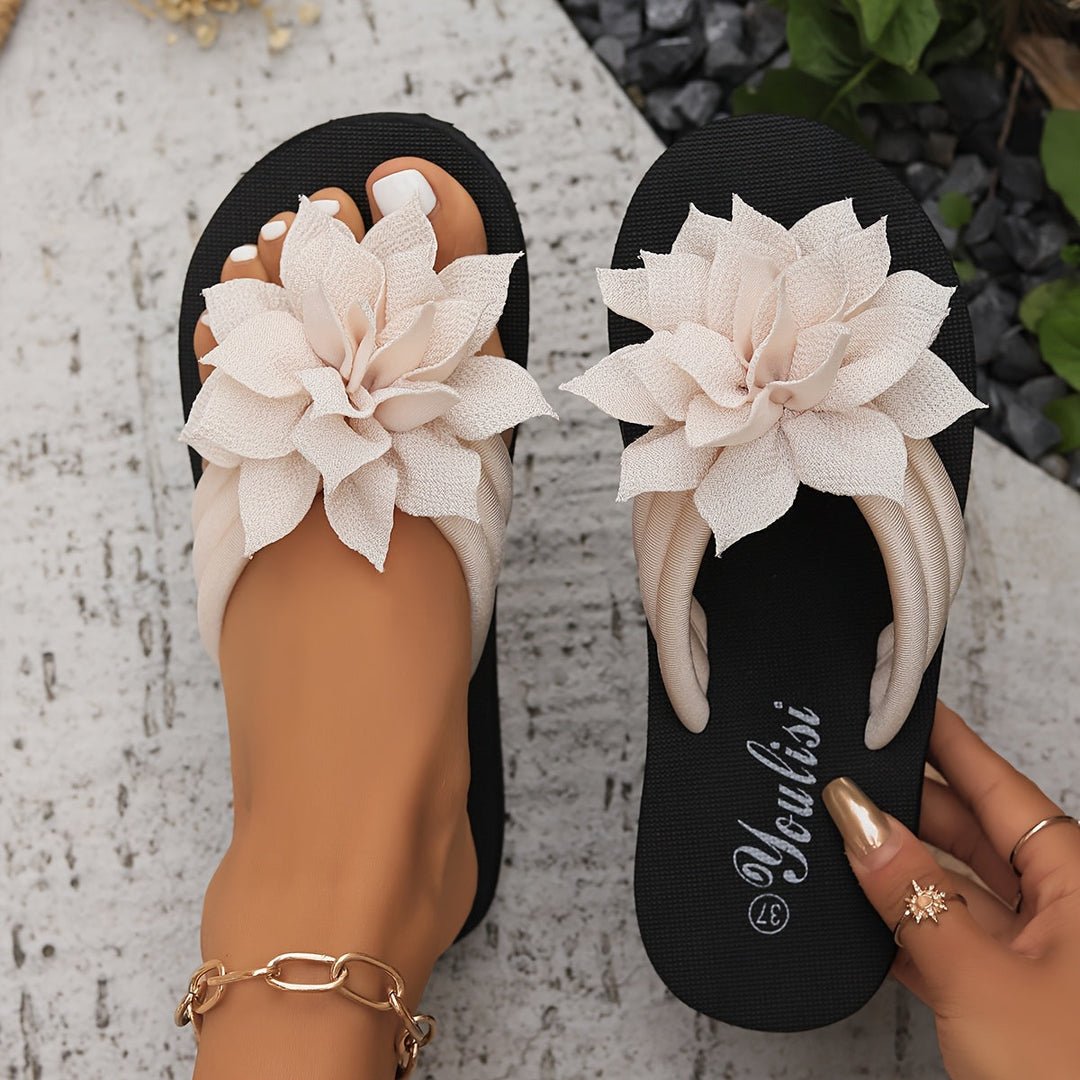Women's platform flip flops, wide fit, with charming floral strap details.