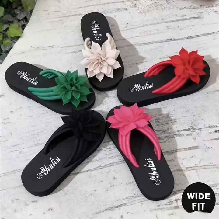Platform sole flip flops for women with a wide fit and decorative floral elements.