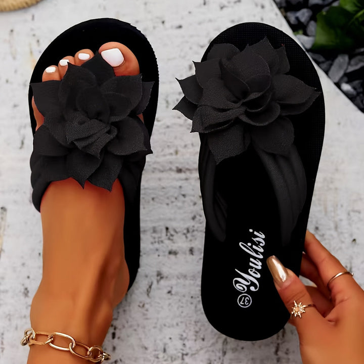 Slip-on wide fit platform sandals for women, adorned with pretty floral patterns.