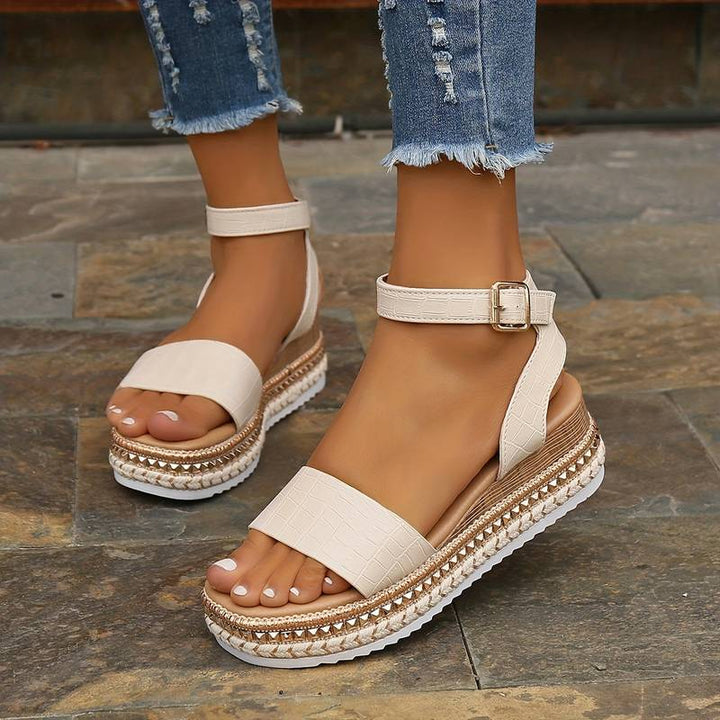 Women's platform sandals with secure ankle strap, open toe, perfect for summer beach & vacation style.