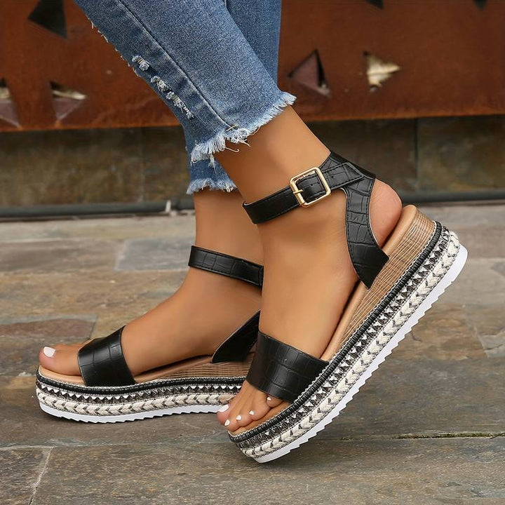 Vacation style women's platform sandals, open toe with a secure ankle strap and textured sole.