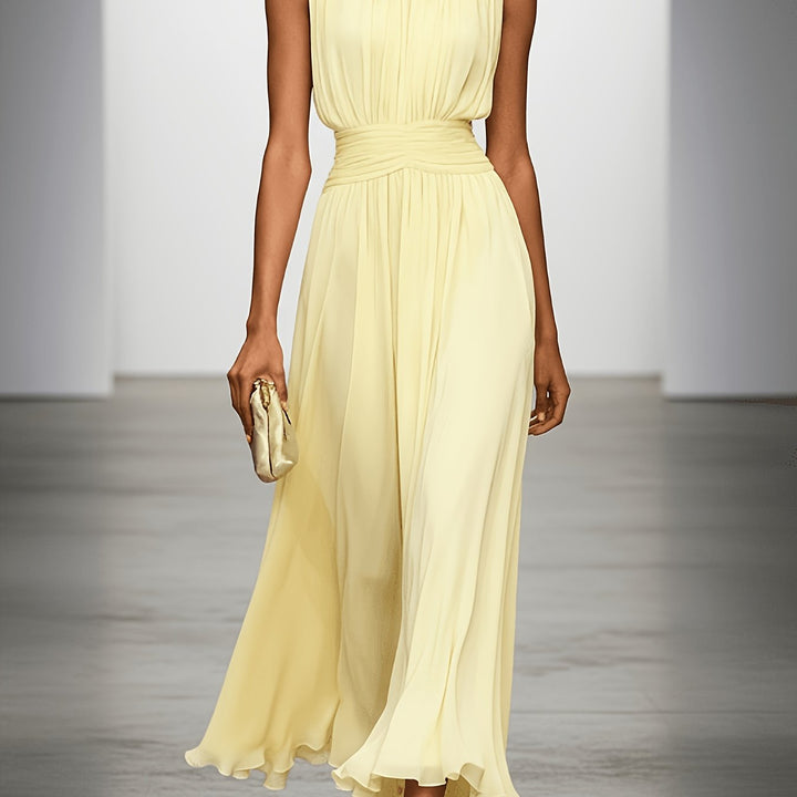 Elegant women's occasion dress: pleated maxi with ruched waist, perfect as a wedding guest outfit.