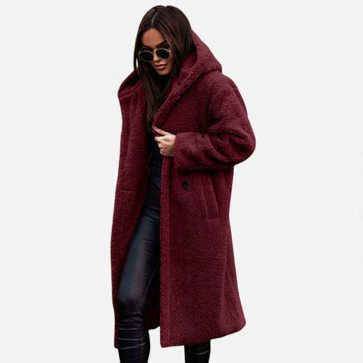 Premium women's long winter coat, plush and soft for elegant warmth in cold weather.