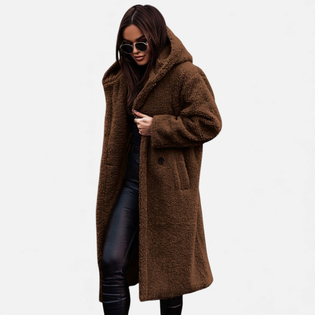 Soft women's plush long coat, perfect for elegant winter fashion and cold weather.