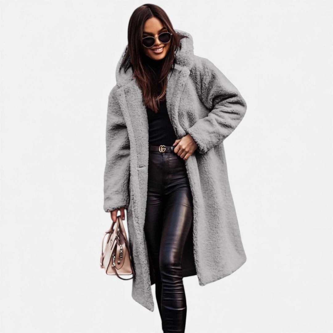 Luxurious women's longline plush winter jacket, offering elegant warmth & comfort.