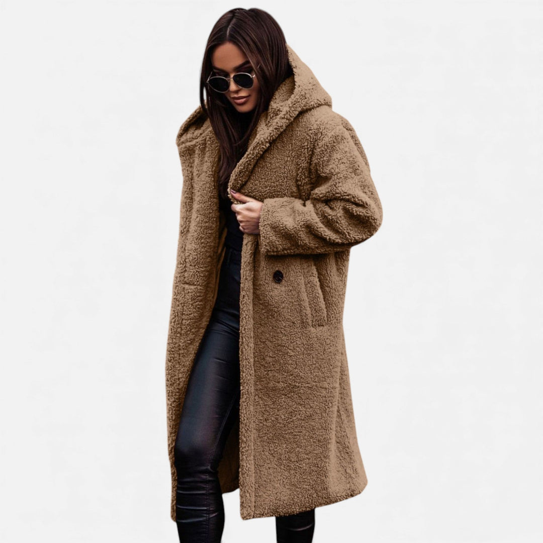 Cozy women's long plush winter coat, elegant and warm for any cold weather occasion.