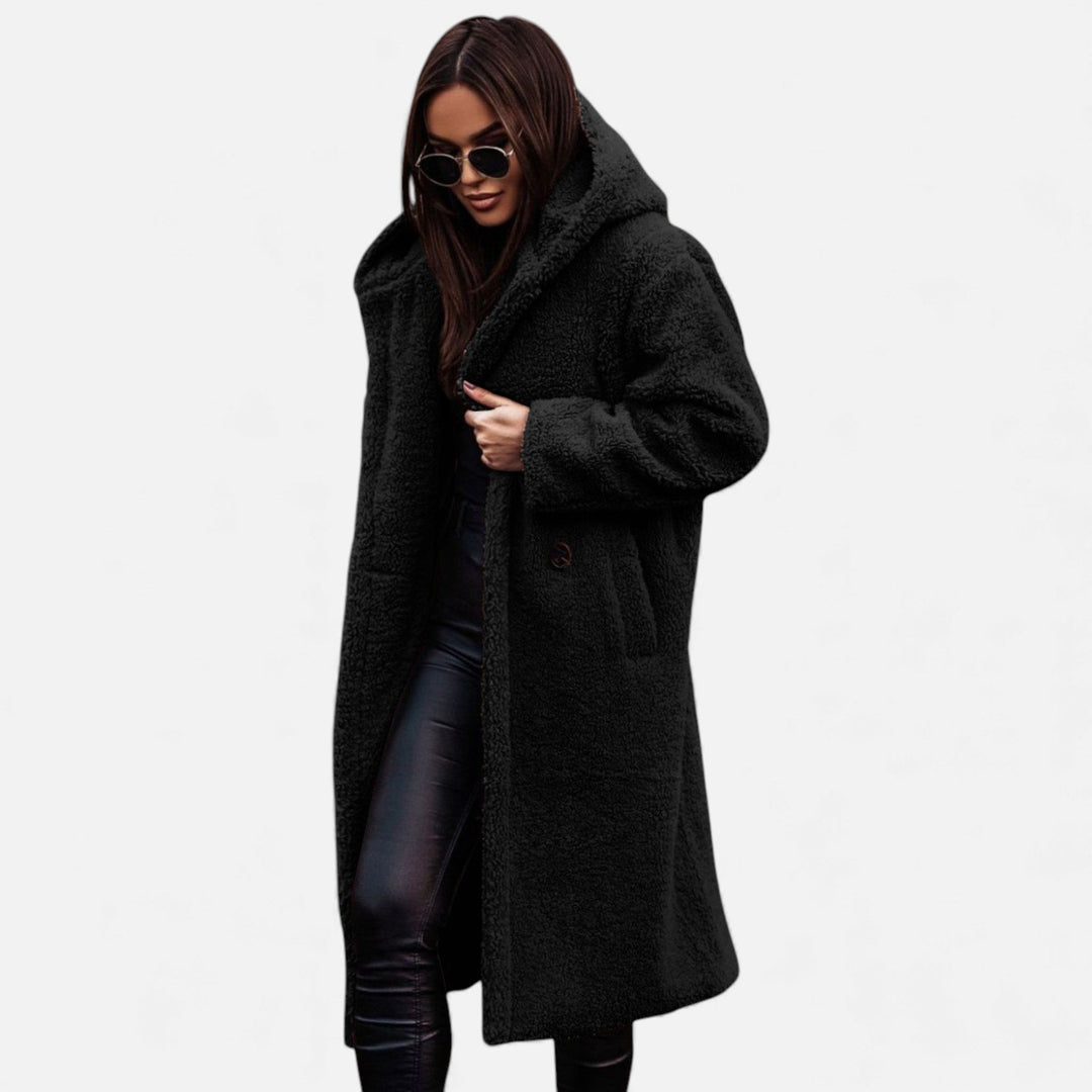 Fashionable women's long plush outerwear, a warm winter coat with elegant design.