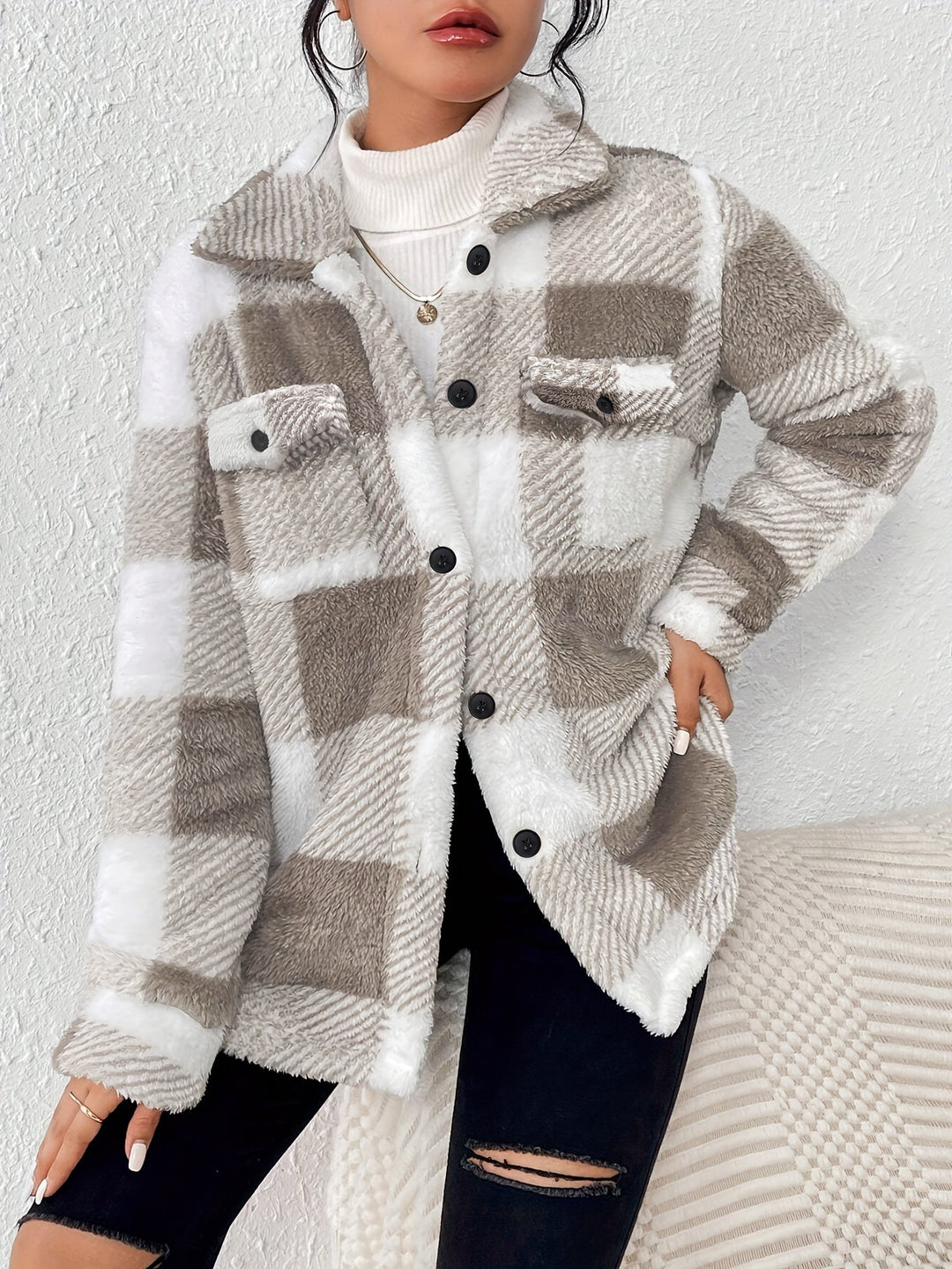 Woman wearing a relaxed-fit plush plaid button-up jacket, casual outerwear, fall style