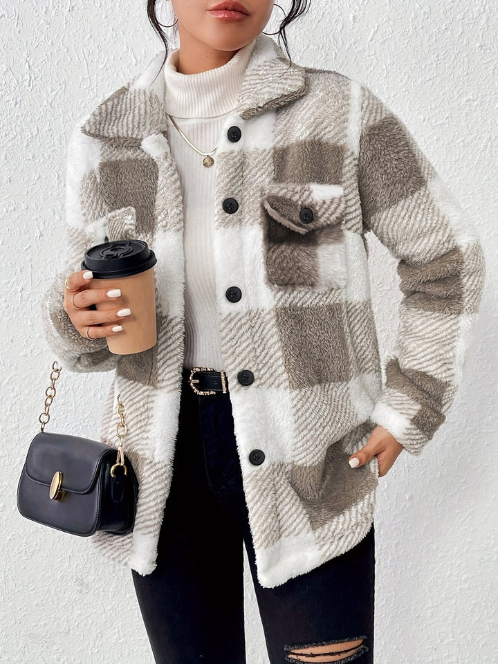 Side profile of a woman in a plush plaid button-up jacket, warm sherpa outerwear