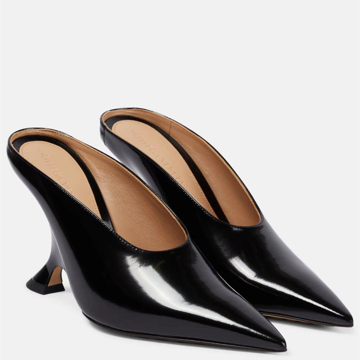 Fashion-forward women's party mules: metallic finish, pointed toe, comfortable wedge, sculpted heel.