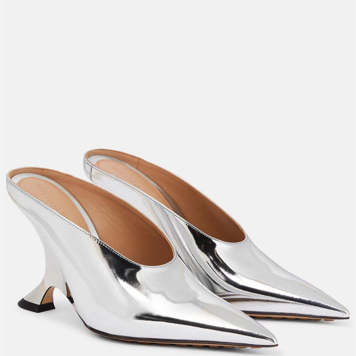 Shiny silver metallic women's wedge mules with a pointed toe and an artistic sculpted heel design.