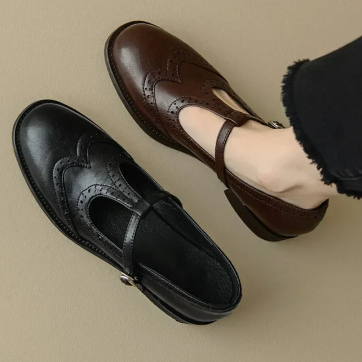 Close-up of black polished T-strap Mary Janes for women, classic vintage design and comfortable fit