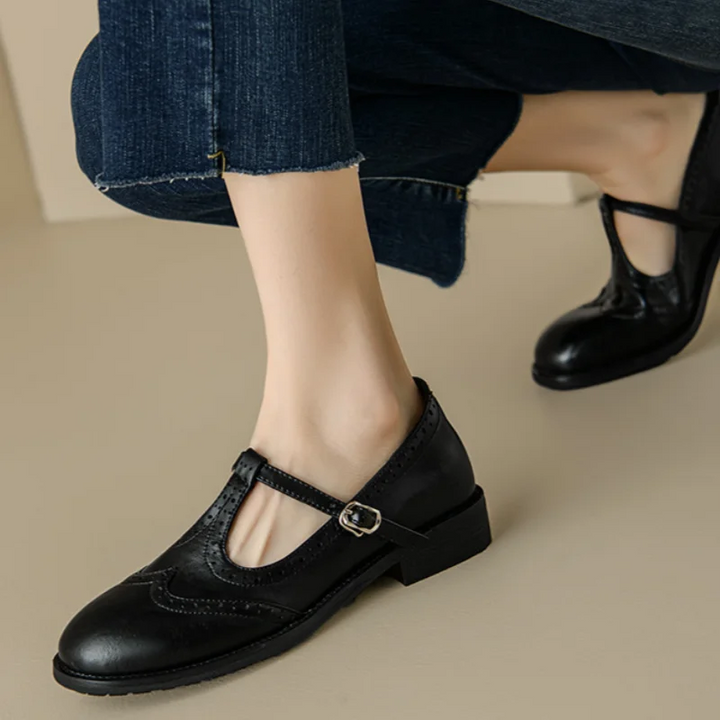 Stylish black women's T-strap Mary Jane flats, comfortable shoes with a refined, vintage look