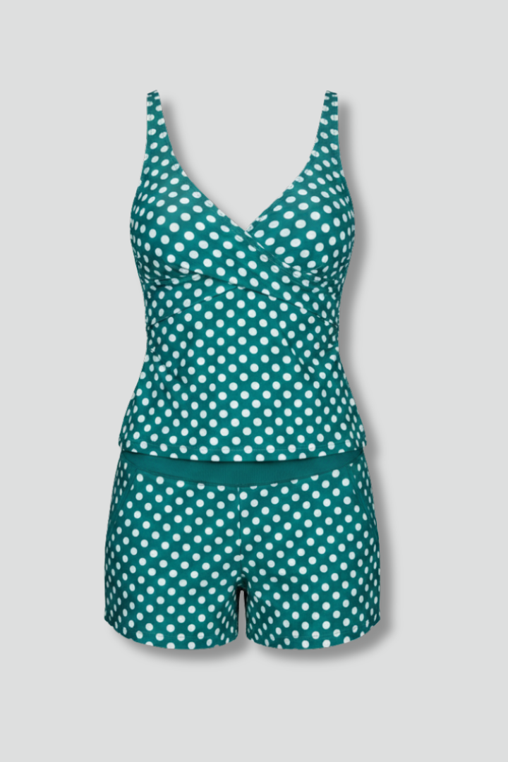 Women's polka dot V-neck tankini top and swim shorts set, perfect for beachwear.